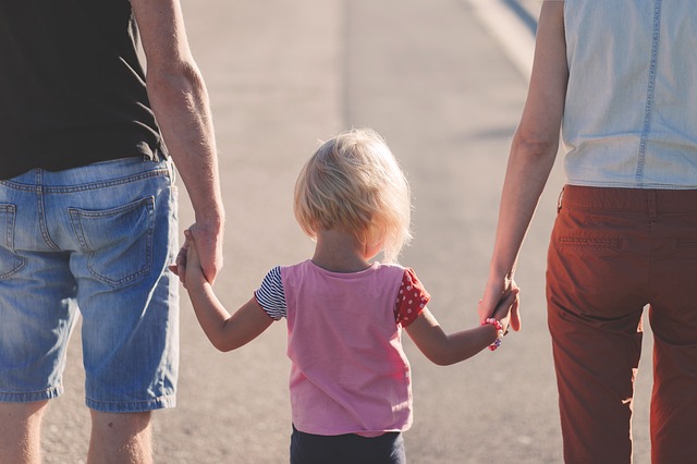 Parents walking child